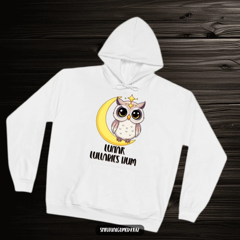 Funny hoodie featuring a starry celestial owl with wide, curious eyes perched on a crescent moon, offering cozy celestial humor.
